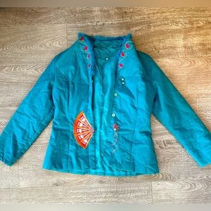Cheerful turquoise padded jacket with pink embroidery.